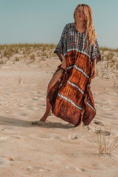 Gorgeous hand tie dyed plant viscose kaftan crafted in a harmonious collaboration of indigo, rust, and caramel dyes. This versatile piece provides a bohemian boxy shape, but comes with a matching fabric belt to cinch in for a tailored fit or use as an elegant hair band. Perfect for a cover-up to get out of the sun, or throw it on for immediate upscale boho style. As part of Gardenbelle Shop's commitment to quality and unique fashion, this kaftan embodies both comfort and chic sophistication. Emb Bohemian Rayon Cover-up For Vacation, Bohemian Batik Print Maxi Dress For Festival, Flowy Festival Dress With Natural Dye, Bohemian Rayon Kaftan For Summer, Bohemian Maxi Dress With Natural Dye For Summer, Bohemian Natural Dye Maxi Dress For Summer, Flowy Hand Dyed Festival Dresses, Flowy Hand Dyed Dresses For Festivals, Bohemian Hand-dyed Festival Dress