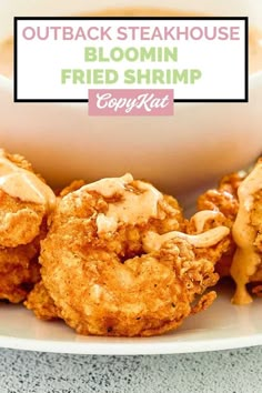 the fried shrimp is served on a plate with sauce