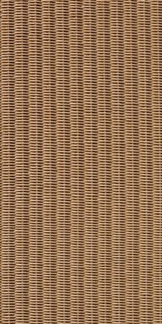 a close up view of the woven fabric on a tablecloth, with brown and tan colors