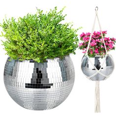 a potted planter with pink flowers in it next to a mirror ball hanging planter