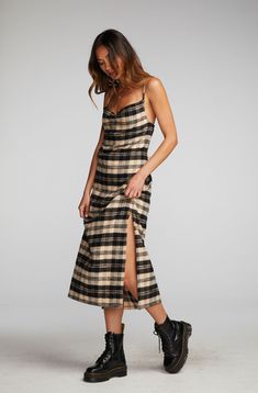 If you don't own Flannel in your winter wardrobe, have you ever gone shopping? Our Flannel Midi Slip Dress is equal parts seasonal and stylish, with a Side-Slit and some cleavage. Pair with black combat boots for an effortlessly edgy aesthetic. Black and beige are a combo of the season, so prepare for plenty of wear! Flannel Midi Slip Dress Fabric Content: 100% Cotton Model is 5'9" and wearing size small Imported Style: CW9354-LP Flannel Over Dress, Dress And Combat Boots Outfit, Combat Boots With Dress, Dress With Combat Boots, Combat Boot Outfit, 90s Slip Dress, Punk Dress, Edgy Aesthetic, Flannel Dress