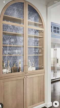 a large wooden cabinet with glass doors