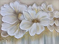 three white flowers on a gray and gold background