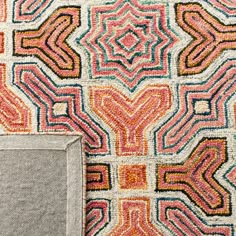 an area rug with different colors and shapes