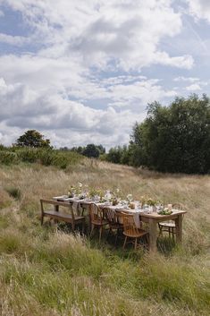 a table set up in the middle of a field