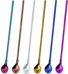 four different colored metal spoons with handles