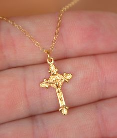 "This is a 14Krose gold filled crucifix cross charm necklace.  This is a beautiful ornate crucifix cross in 18kt rose gold filled, measures 20x12mm and comes on a 14kt rose gold filled shiny cable chain with spring clasp.  Choose length of 16\", 18\", 20\" or 22\".  Comes in a cute gift box ready to present.  STERLING SILVER VERSION NOT SHOWN. *Model is wearing a 16\" length in the photo. GOLD IN PHOTO IS OUT OF STOCK AND WILL NOT BE RETOCKED. ONLY ROSE GOLD AND STERLING SILVER LEFT." Gift Rose Gold Crucifix Cross Necklace, Dainty Rose Gold Crucifix Jewelry, Rose Gold Crucifix Jewelry For Gifts, Catholic Jewelry Necklace, Scapular Necklace, 14kt Gold Jewelry, Jesus Gift, Cross Charm Necklace, Cross Necklace Women