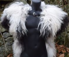 a mannequin with white and black fur on it