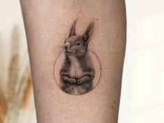 a small rabbit tattoo on the leg