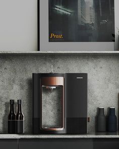 a black and silver sink in a bathroom next to a shelf with bottles on it