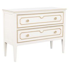 a white dresser with two drawers and gold trimmings on the bottom, against a white background