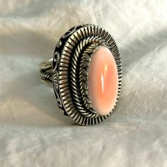 Vintage Secret Compartment Sterling Silver Pink Conch Statement Ring. This Is A Size 7 Or 7 1/2and Is Probably The Most Unusual Beautiful Ring I Have Ever Seen. One Of A Kind Because I Can’t Find Anything Like It! The Amount Of Detail On This Ring And Construction Is Mind Blowing. First Of All The Stone (Pink Conch) Is Stunning And Large. The Top Comes Off To Reveal A Nice Size Storage Space! This Is Also A Lot Of Sterlingnice Weight To It. Stamped Sterling. Love!!!! I Even Like How The Inside Storage Looksall Rainbow Colors. I Would Leave As Isperfection. Secret Compartment, Conch, Mind Blown, Womens Jewelry Rings, Rainbow Colors, Pink Ladies, Beautiful Rings, Statement Rings, Sterling Silver Rings