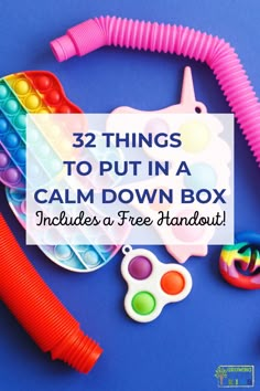 Picture of different fidget tools on a blue tabletop. White text overlay with blue text says "32 things to put in a calm down box." Black text below says "Includes a free handout!" Calm Box, Coping Toolbox, Comfort Box, Calm Kids