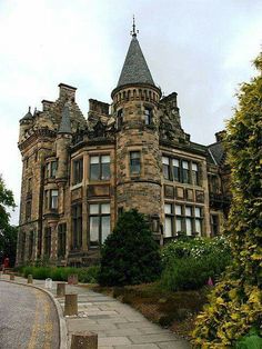 an old castle like building with a clock tower