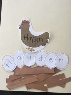 this is an image of a chicken and letters made out of construction paper with the word haylath on it