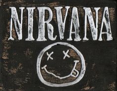 a wooden sign that says nirvana with a smiley face