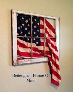 an american flag hanging on the side of a window with text reading red, white and blue