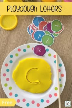 this is an image of playdoun letters on a plate with the letter c