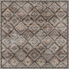 an area rug with brown and black squares