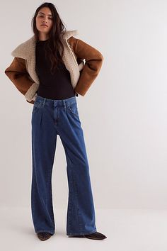 A cool denim classic, these trouser-style jeans from our We The Free collection deserve a spot in every denim drawer. **Fit:** Mid-rise, loose flare silhouette **Features:** Zip fly and button closure, five-pocket styling, pleating at top for added shape, soft linen-denim blend **Why We ❤ It:** Toughened up with moto boots or off-duty with court sneakers, this pair has endless ways to wear. | We The Free Sheridan Trouser Flare Jeans at Free People in Dark Wash, Size: 30 Cool Denim, Jeans Free People, Free People Jeans, Style Jeans, Sweater Dress Women, Cape Dress, Denim Jacket Men, Trouser Style, Mens Scarves