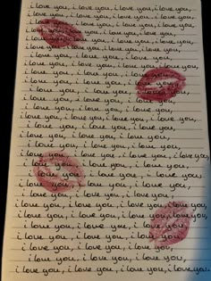 a piece of paper with writing on it and two red lips drawn in the middle