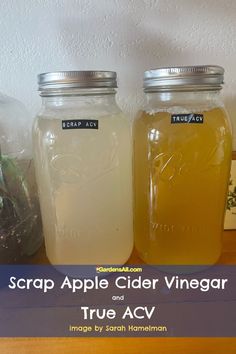 three jars filled with liquid sitting on top of a table