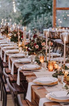 a long table is set with candles and plates