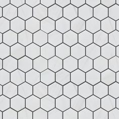 an image of a white tile pattern that looks like hexagonal tiles