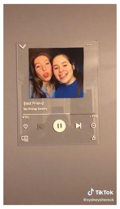 two women are smiling and making funny faces on the appliance's screen