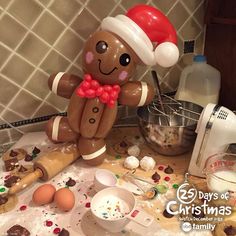 a gingerbread man made out of doughnuts and other ingredients on a kitchen counter