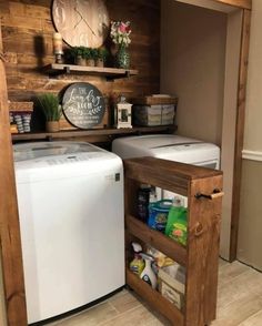 a small laundry room with a washer and dryer in the corner next to it