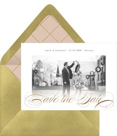 a card with an image of a man and woman dancing in the street, says save the date