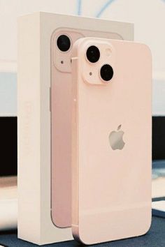 an apple iphone in its box with the back facing up to it's camera