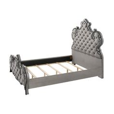 the bed frame is upholstered with an intricate design