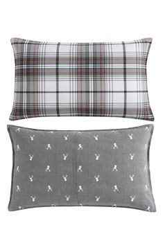 two pillow cases with dogs on them, one in grey and the other in white