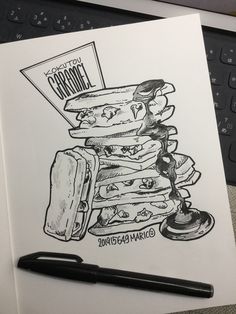 a drawing of a stack of burgers on top of each other next to a keyboard