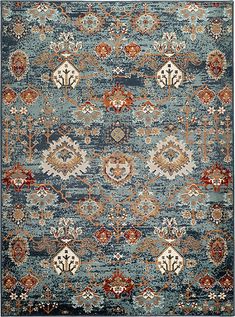 an area rug with various colors and designs on the carpet, including blue, red, orange