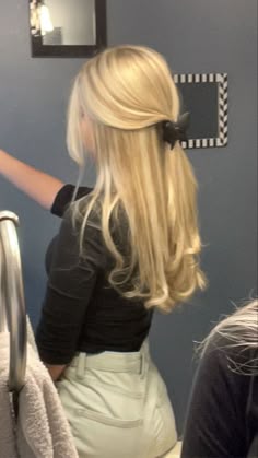 blonde hair pulled back into a clip