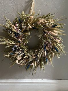 a dried wreath hanging on the wall