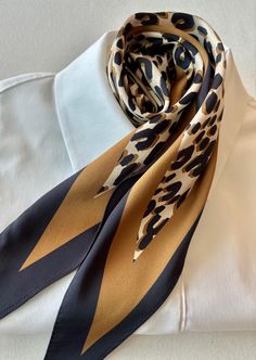 Welcome to GirlZtr! Add a touch of sophistication to your outfit with this luxurious silk satin scarf featuring a bold leopard print design. Measuring 42x11 inches (107x28 cm), this scarf is crafted from high-quality silk satin, offering a smooth and soft texture. Its versatile size makes it perfect for styling around the neck, tying onto a handbag, or adding flair to any look. Whether you're dressing up for an event or adding a chic touch to everyday wear, this scarf is an elegant accessory to Satin Scarf, Leopard Pattern, Elegant Accessories, Accessories Unique, Bandanas, Silk Satin, Silk Printing, Scarf Accessory, Leopard Print