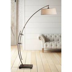 a lamp that is on top of a wooden floor