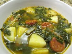 a white bowl filled with soup and vegetables