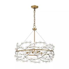 a chandelier with white flowers hanging from it's center point and gold chain