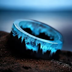 ✨ Elevate Your Style: Enchanting Blue Resin Ring with Wooden Mountains ✨ -Immerse yourself in the magic of this unique resin ring, a wearable piece of art that transports you to a tiny landscape within. Perfect for both women and men, this ring features wooden mountains embedded in captivating blue resin, creating a whimsical and punk-inspired piece with a touch of fantasy. 🔗 Key Features: -Magical Blue Resin: The enchanting blue resin captures a mesmerizing world within the ring, adding a touch of magic to your everyday style. -Wooden Mountains Inside: Delicately crafted wooden mountains are intricately placed within the resin, creating a tiny landscape that tells a unique story. -Unique for Women and Men: Versatile and unisex, this ring is designed to make a statement on any finger, mak Secret Wood Rings, Tiny Landscape, Cool Rings For Men, Mountain Ring, Rhinestone Art, Magical Jewelry, Punk Jewelry, Resin Ring, Natural Scenery