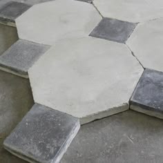 several hexagonal cement tiles laid on top of each other