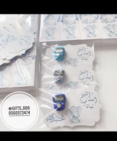 there are some blue and white items in the package on the table with it's price tag