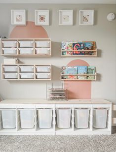 a room with several bins and shelves on the wall