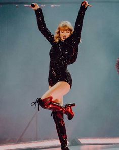 taylor swift performing on stage during a concert