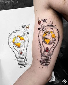 a man with a tattoo on his arm has a globe in a lightbulb