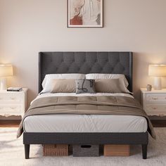 a bedroom with a bed, nightstands and two lamps on either side of the bed